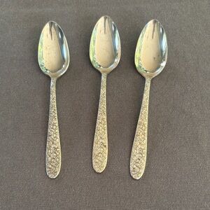 Set of three Narcissus pattern silver teaspoons by National Silver
